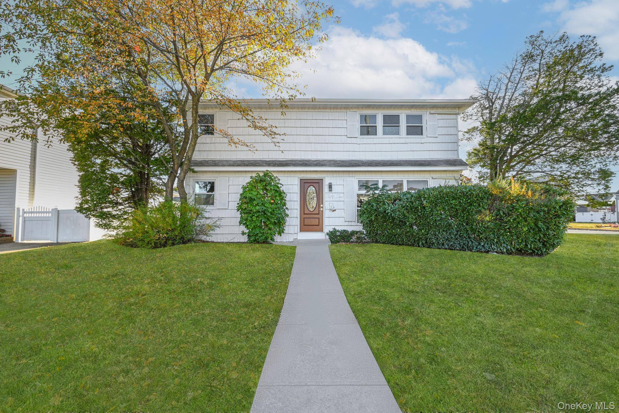 Step into the ultimate blend of elegance, space, and convenience in this distinguished Valley Stream residence.