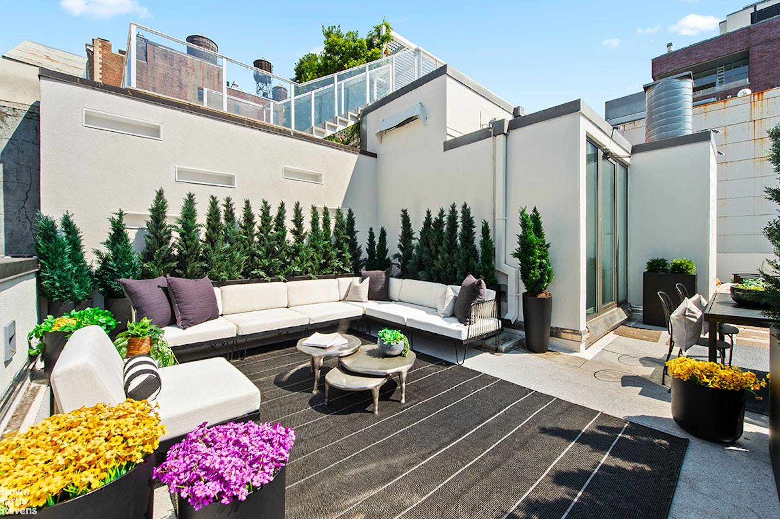 Glorious floor through penthouse with a beautiful private rooftop in the premier full service condo, One Kenmare Square.