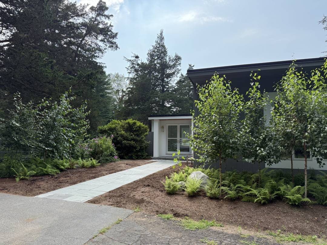 Nestled in the charming New England town of Madison, CT, this contemporary ranch home offers a spacious comfortable summer retreat.