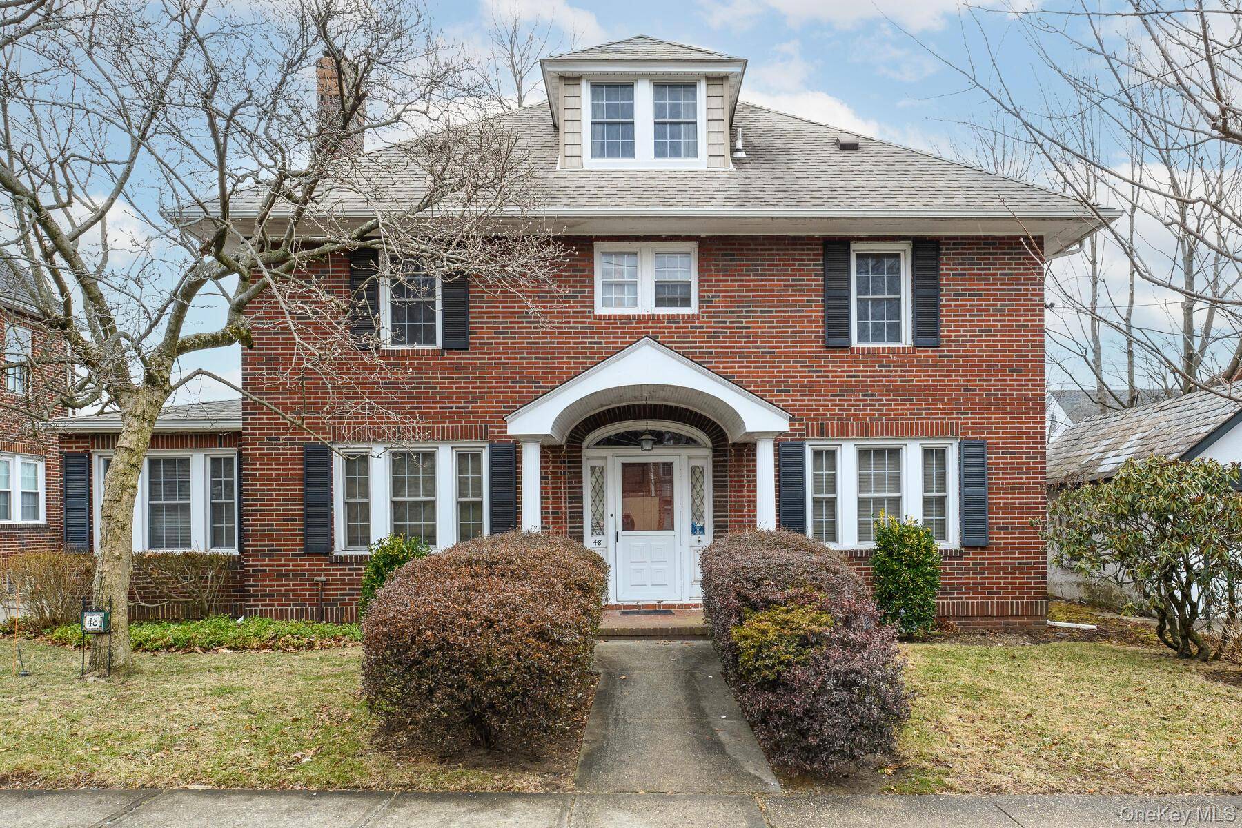 Nestled in the Baker Hill section of Great Neck, this stately center hall Colonial sits proudly on a 60 x 100 lot, offering timeless charm and incredible potential.
