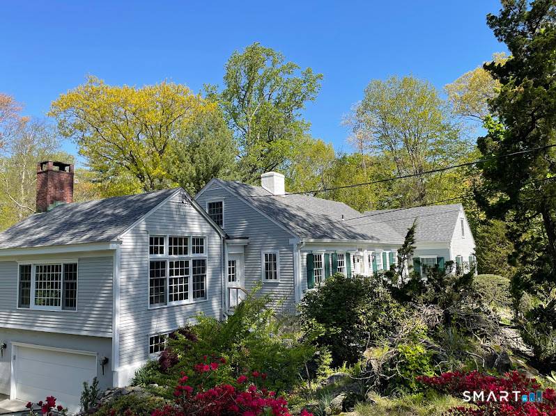 With a total renovation completed in 2024, this pristine, airy gem offers both privacy and convenience.