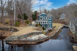 A WATERFRONT MASTERPIECE with guesthouse !