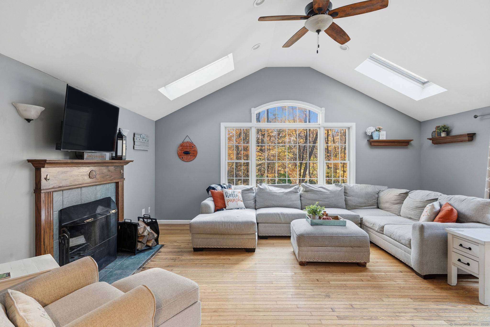 Tucked away on a private lot surrounded by mature trees, this beautiful Raised Ranch offers the perfect blend of light, space, and comfort.