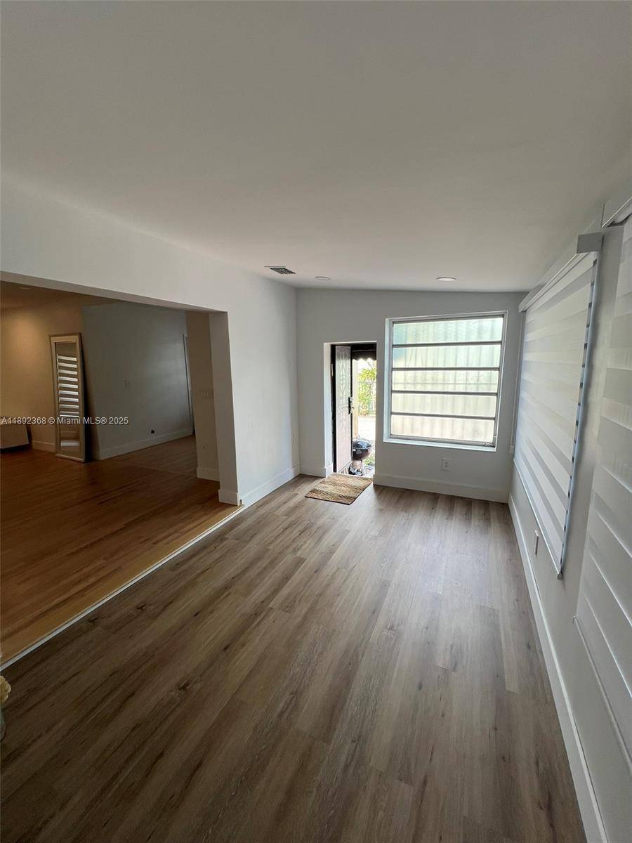 Modern Style 3 bedroom 1 bathroom house with full wood floors thought out the home.
