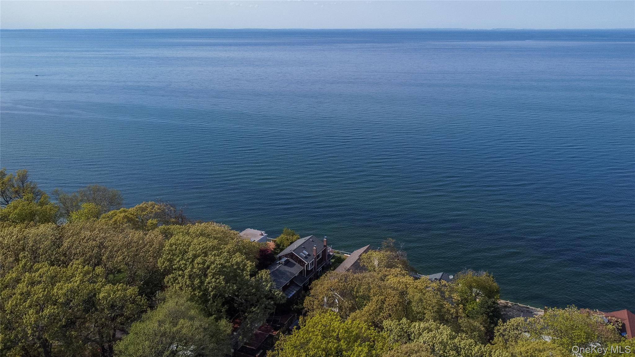 Tucked away in one of the North Shore's most exclusive and private beach communities, this custom designed waterfront home is a rare find a true hidden gem offering privacy, elegance, ...