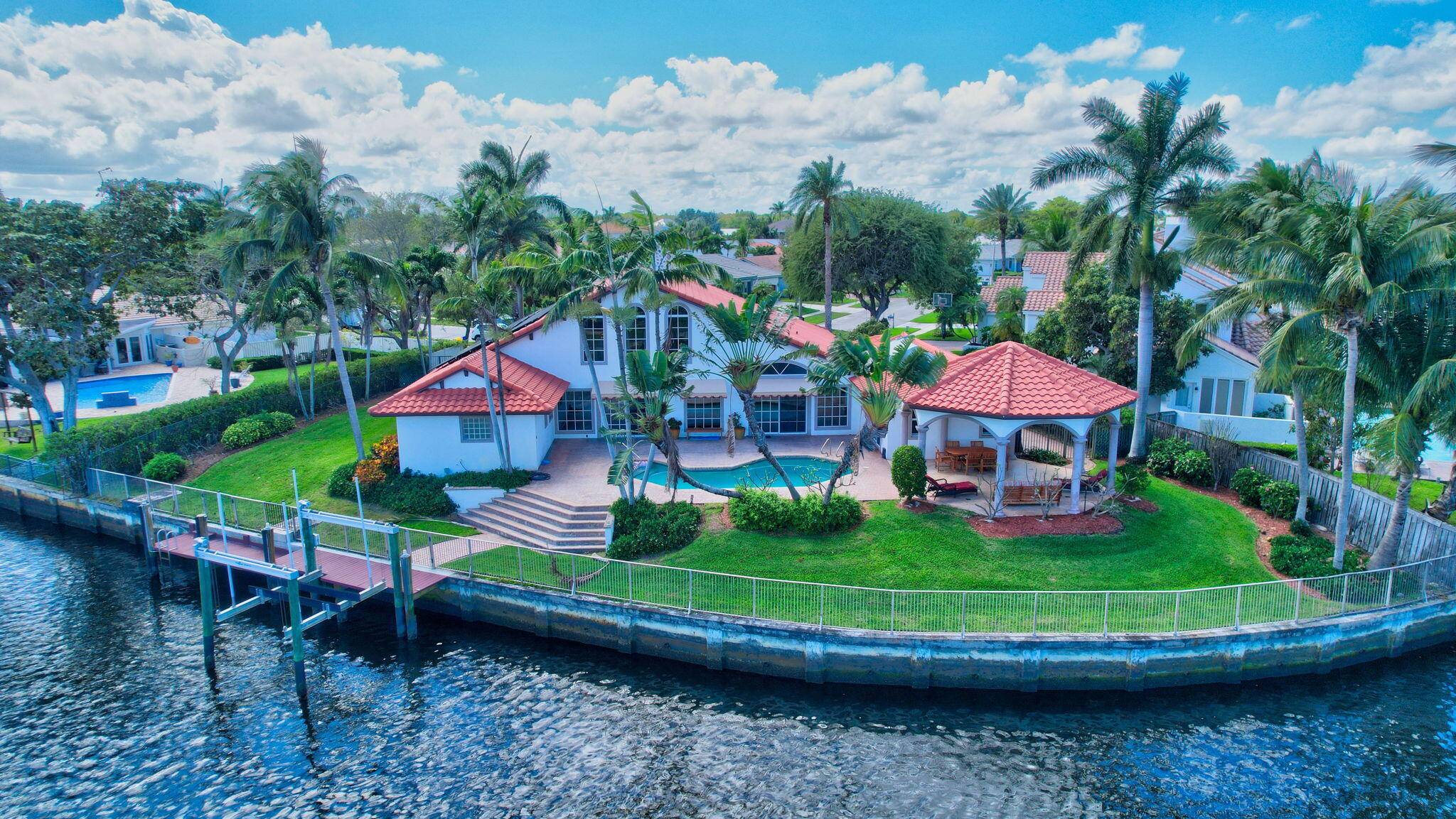 Rarely available ! Ocean Access home on intersecting canals with wide water views all around !