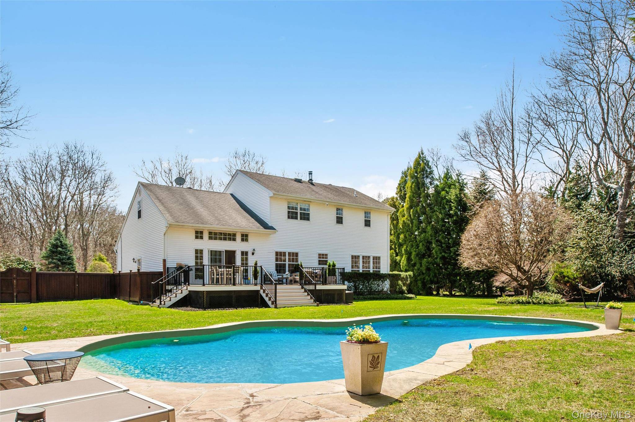 Summer 2026 starts in Westhampton's popular Mill Pond neighborhood With 5 beds and 3 1 2 baths there is room for everyone at 39 Hollow Lane.