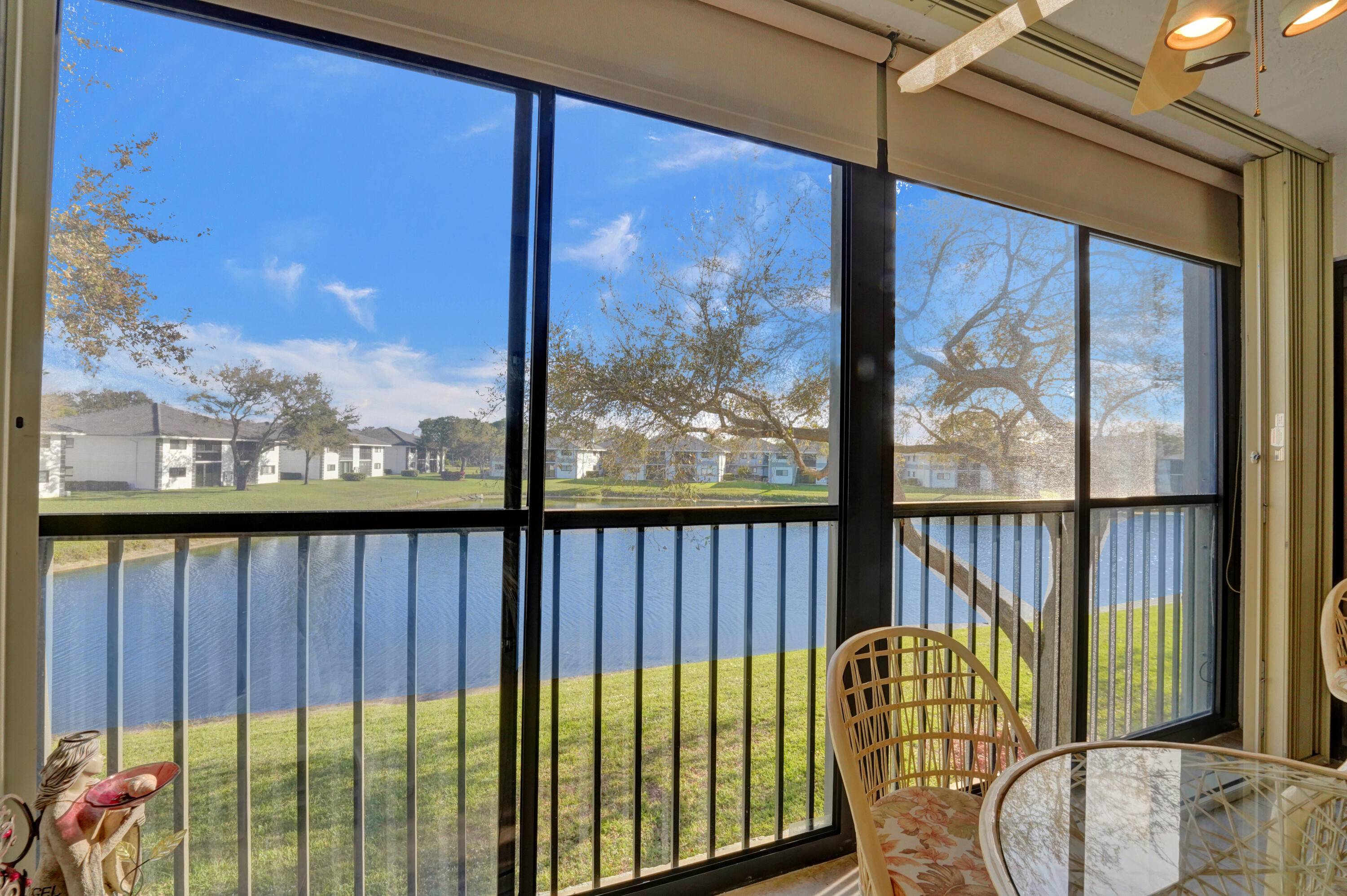 What a PLEASURE to present this SPOTLESS home with surrounding water views in this most desirable 55 Community.