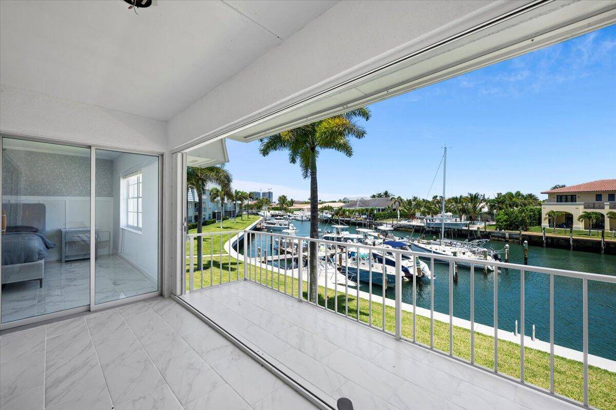 Experience contemporary coastal living in this exquisite waterfront 2 bedroom, 2 bath condo with unparalleled skyline views overlooking the Waterway and Sugar Sands Marina.
