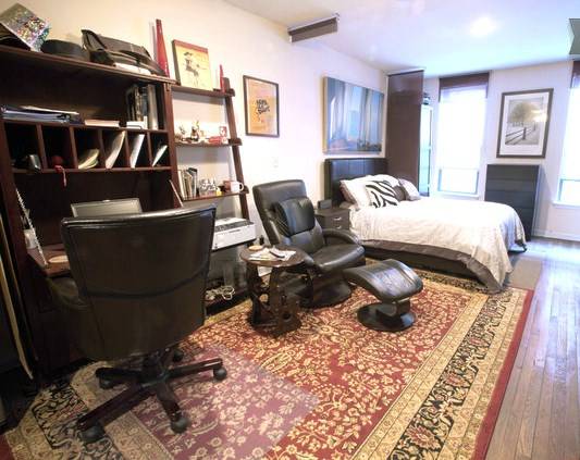 Exposed Brick Accentuates this Charming Studio in Great Location.