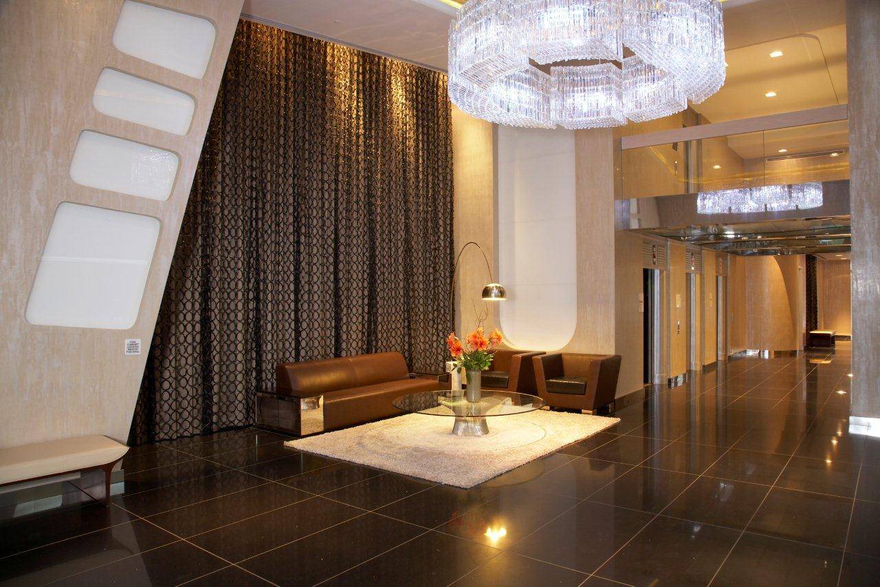 furnished or unfurnished  loft studio with 12 ft ceilings , no fee, amenity driven bldg. 