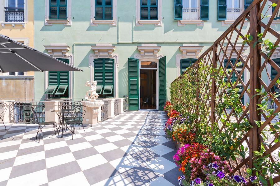Stunning shared terrace furnished with umbrellas and tables 