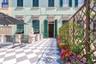 Stunning shared terrace furnished with umbrellas and tables 