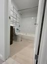 Full bathroom featuring toilet, vanity, and bathing tub / shower combination