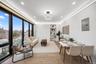 Dining space with electric panel, wood finished floors, a view of skyline, and recessed lighting