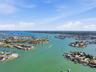 Aerial photo high above 4 Bellevue looking northwest towards Treasure Island Causeway drawbridge allowing access to the Gulf for sailboats and larger