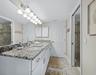 The primary ensuite bath has a separate water closet and a large walk-in closet