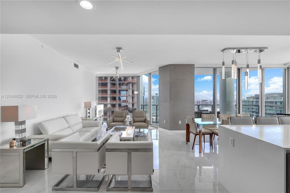 Waterfall quartz island with integrated sink and built-in Miele oven