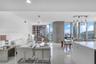 Waterfall quartz island with integrated sink and built-in Miele oven