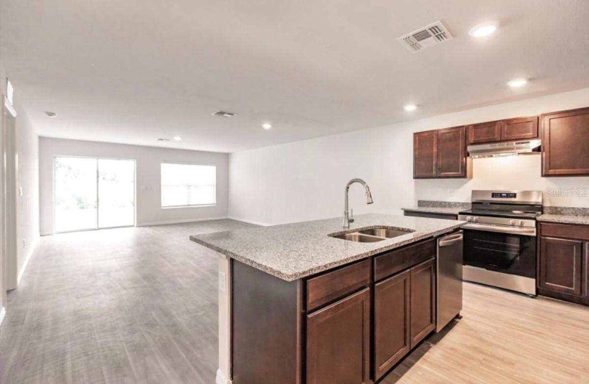 Great room standing by kitchen.