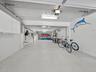 The right garage bay is generous enough for multiple cars, boats, golf carts, or other island toys.