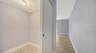 Primary walk-in closet.