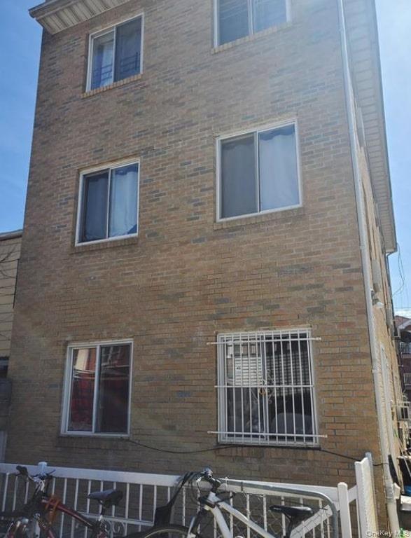 View of side of home featuring brick siding