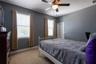 Bedroom 1 with a walk-in closet.