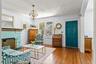 Large Living Room with Brick Painted Fireplace