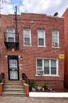 Traditional-style house featuring brick siding