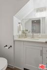 Bathroom featuring a sloped ce