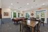 Clubhouse game room with Billiards and table seating