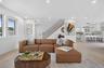 Open concept living area featuring light wood-finish flooring