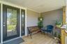 View of wooden front porch deck
