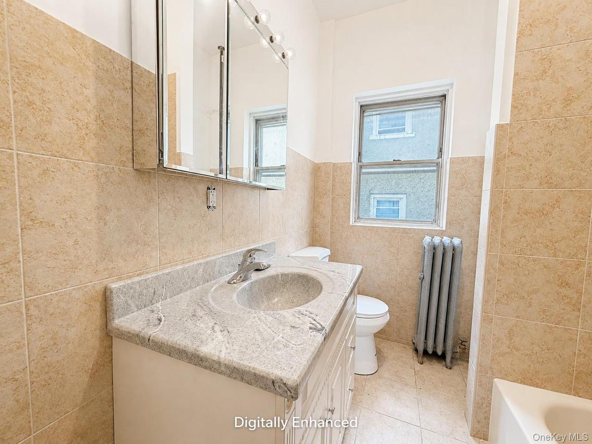 Vanity with an integrated sink and stone-finish countertop