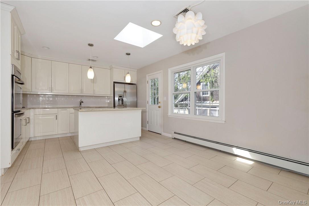 Another angle view of Kitchen, Door to wood deck