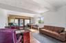 Office featuring light wood finished floors, beamed ceiling, and a paneled ceiling