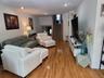 Spacious Living Room with BEAUTIFUL Wood Floors.
