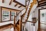 grand original curved staircase to 3rd floor with  original wood