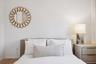 Bedroom with wood finished floors and baseboards