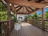 The expansive deck also enjoys a large covered seating area overlooking the natural bayou.Covered space when you want to be outdoors, but have had ple