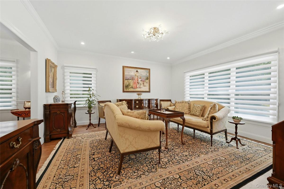 Formal living room with custom blinds