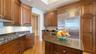 STONE COUNTERTOPS AND SOLID WOOD CABINETS