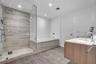 Private water closet with wood-look tile flooring