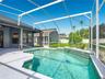 Enjoy your private screened-in pool, perfect for Florida living year-round