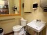Half bath featuring a sink and toilet
