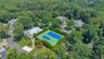Community amenities featuring tennis courts, an outdoor swimming pool, and a recreational building