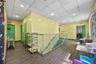 Corridor with wood finished floors, an upstairs landing, a paneled ceiling, and recessed lighting