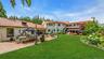 View of grassy yard with a patio area and outdoor lounge area