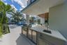 The back patio features a fully equipped BBQ area, perfect for outdoor entertaining and al fresco dining.